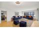 Bright living room with modern furniture, stylish rug, and large windows overlooking city views at 3481 Lakeside Ne Dr # 807, Atlanta, GA 30326