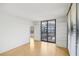 Airy living room with hardwood floors, balcony access, and ample natural light at 3481 Lakeside Ne Dr # 807, Atlanta, GA 30326