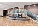 Upscale lobby with staircase, glass railings, and elegant marble flooring at 3481 Lakeside Ne Dr # 807, Atlanta, GA 30326
