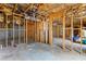 Unfinished basement with exposed framing, wiring, and ductwork, providing a blank canvas for personalized design at 4695 Ferncrest Pl, Douglasville, GA 30135
