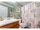 Cozy bathroom featuring patterned shower curtain and warm, inviting decor at 4695 Ferncrest Pl, Douglasville, GA 30135