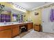 Well-lit bathroom with a long countertop and storage space at 4695 Ferncrest Pl, Douglasville, GA 30135