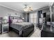 Comfortable bedroom with plush carpet, ceiling fan, and dark furniture at 4695 Ferncrest Pl, Douglasville, GA 30135