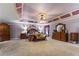 Spacious primary bedroom with an elegant ceiling fixture and ample furniture at 4695 Ferncrest Pl, Douglasville, GA 30135