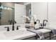 Bathroom features double sinks with stylish fixtures, quartz countertops, and an expansive mirror at 733 Stickley Oak Way, Woodstock, GA 30189