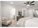 Bright bedroom includes a sitting area, doorway to the en-suite bathroom and an airy, comfortable space at 733 Stickley Oak Way, Woodstock, GA 30189