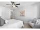 Relaxing bedroom with a ceiling fan, chair and neutral tones for comfort at 733 Stickley Oak Way, Woodstock, GA 30189