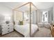 Charming bedroom with a four-poster bed, soft decor and bright window views at 733 Stickley Oak Way, Woodstock, GA 30189