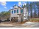 Modern two-story home with clean lines, a small yard, and private parking at 733 Stickley Oak Way, Woodstock, GA 30189