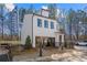 Two-story home with white siding, black trim, and professional signage at 733 Stickley Oak Way, Woodstock, GA 30189