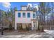 Charming two-story home with white siding, black trim, and a well-manicured front yard at 733 Stickley Oak Way, Woodstock, GA 30189