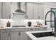 Bright kitchen features grey cabinets, white countertops, modern appliances, and stylish fixtures at 733 Stickley Oak Way, Woodstock, GA 30189