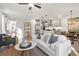 Spacious open-concept living room offers seamless flow with kitchen and dining areas at 733 Stickley Oak Way, Woodstock, GA 30189