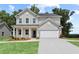 Beautiful two-story home with a welcoming front porch and manicured lawn at 808 Tupelo Way, Villa Rica, GA 30180