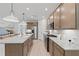 Stylish kitchen with a large island, wooden cabinets, and stainless steel appliances at 808 Tupelo Way, Villa Rica, GA 30180