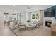 Bright living room featuring a fireplace, hardwood floors, and stylish furniture at 808 Tupelo Way, Villa Rica, GA 30180