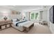 Cozy main bedroom with a decorative headboard, accent wall, and natural light at 808 Tupelo Way, Villa Rica, GA 30180