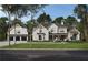 Beautifully designed two-story home featuring a brick facade, black trim, and a meticulously manicured lawn at 202 Kenneth Drive, Alpharetta, GA 30009