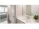 Bright bathroom featuring a white vanity, a clean mirror, and modern fixtures at 3560 Chattahoochee Rd, Cumming, GA 30041