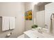 Bright bathroom with a vanity, mirror, and towel rack at 3560 Chattahoochee Rd, Cumming, GA 30041