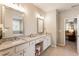 Spacious bathroom featuring double vanity with granite countertops and neutral decor at 3560 Chattahoochee Rd, Cumming, GA 30041