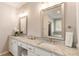 Elegant bathroom with double sinks, granite countertops, and framed mirrors that create a luxurious space at 3560 Chattahoochee Rd, Cumming, GA 30041