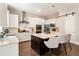 Spacious kitchen with island, modern appliances, and stylish bar stools at 3560 Chattahoochee Rd, Cumming, GA 30041