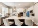Modern kitchen featuring a large island with seating, sleek appliances, and bright lighting at 3560 Chattahoochee Rd, Cumming, GA 30041