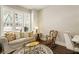 Bright and airy living room featuring large windows, comfortable seating, and stylish decor at 3560 Chattahoochee Rd, Cumming, GA 30041