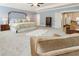 Large main bedroom boasts sitting area, soft carpet, and neutral paint colors for a serene retreat at 3560 Chattahoochee Rd, Cumming, GA 30041