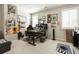 A creative home office with eclectic decor, multiple monitors, and comfortable seating at 3560 Chattahoochee Rd, Cumming, GA 30041
