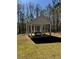 Open-air pavilion with picnic tables in a grassy park setting, perfect for outdoor gatherings at 3560 Chattahoochee Rd, Cumming, GA 30041