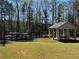 Community pavilion with picnic tables and kayak storage near the lake, perfect for recreation at 3560 Chattahoochee Rd, Cumming, GA 30041