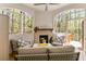 Cozy sunroom with fireplace and comfortable seating, great for relaxation at 3560 Chattahoochee Rd, Cumming, GA 30041