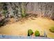 An aerial view of the expansive backyard featuring mature trees at 6355 Valhalla Dr, Douglasville, GA 30135