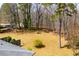 An aerial view of the backyard with mature trees and partial fence at 6355 Valhalla Dr, Douglasville, GA 30135