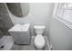 Updated bathroom featuring modern vanity, gray tiled shower, and updated toilet at 6355 Valhalla Dr, Douglasville, GA 30135