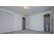 Neutral carpeted bedroom featuring closet and access to a bathroom with toilet at 6355 Valhalla Dr, Douglasville, GA 30135