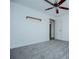 Bedroom featuring ceiling fan, carpet, and a closet with shutter doors at 6355 Valhalla Dr, Douglasville, GA 30135