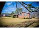 Charming brick home with a lush green lawn and covered porch at 6355 Valhalla Dr, Douglasville, GA 30135
