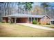 Charming brick home with well-maintained lawn and inviting carport at 6355 Valhalla Dr, Douglasville, GA 30135