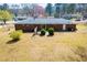 An exterior rear view of the home showcasing the yard and brick facade at 6355 Valhalla Dr, Douglasville, GA 30135