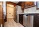 Galley kitchen showcasing wooden cabinets and trim plus stainless steel appliances at 6355 Valhalla Dr, Douglasville, GA 30135