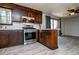 Kitchen with an island, stainless steel appliances, and wood cabinets at 6355 Valhalla Dr, Douglasville, GA 30135