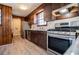 Galley kitchen featuring stainless steel appliances, wood cabinetry, and an open layout at 6355 Valhalla Dr, Douglasville, GA 30135