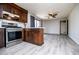 Kitchen featuring stainless steel oven, eat-in island, and modern fixtures at 6355 Valhalla Dr, Douglasville, GA 30135