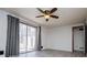 Bright living room featuring sliding glass doors and contemporary gray walls and curtains at 6355 Valhalla Dr, Douglasville, GA 30135
