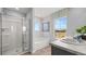 Bright bathroom with a glass door shower, soaking tub, and double sink vanity at 640 Kimberwick Dr, Locust Grove, GA 30248
