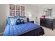 Comfortable bedroom with fun decor, including artwork and a game controller pillow at 640 Kimberwick Dr, Locust Grove, GA 30248