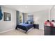 Neutral bedroom with blue bedding and fun framed art at 640 Kimberwick Dr, Locust Grove, GA 30248